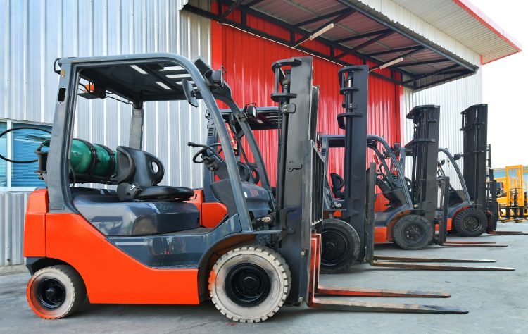 parked-forklifts-warehouse-front